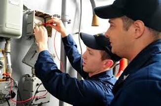 Men working on electric unit